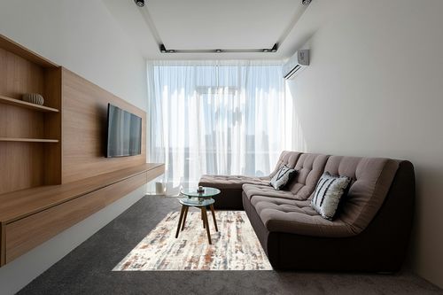 nuLOOM Viviana Transitional Abstract Beige 5 ft. x 8 ft. Area Rug in Grey Living Room with Brown Couch