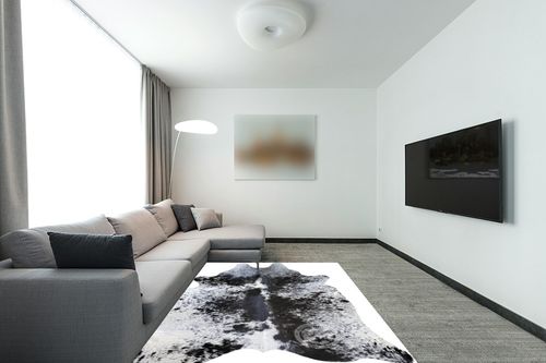 Sunshine Cowhides Genuine Salt and Pepper Black and White Longhorn Cowhide Rug - Luxurious Cow Rug for Bedroom, Living Room, and Home Decor Enthusiasts - Stylish Masterpiece - 6x7ft (180x210cm) in Modern Living Room with Grey Couch