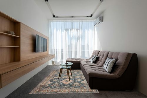 Loloi II Skye Collection SKY-10 SEA / RUST, Traditional 6'-0" x 9'-0" Area Rug in Grey Living Room with Brown Couch