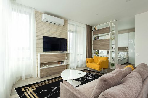 Antep Rugs Babil Gold 8x10 Abstract Marble Geometric Indoor Area Rug (Black, 7'10" x 10') in Light Modern Living Room with TV