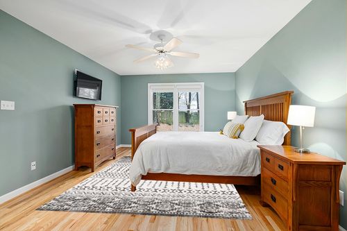 Art&Tuft 8x10 Area Rug, Super Soft Ultra-Thin Moroccan Washable Rug, Anti-Slip Backing Rugs for Living Room, Foldable Geometric Machine Washable Area Rug(8'x10', Black) in Teal and Orange Wood Bedroom