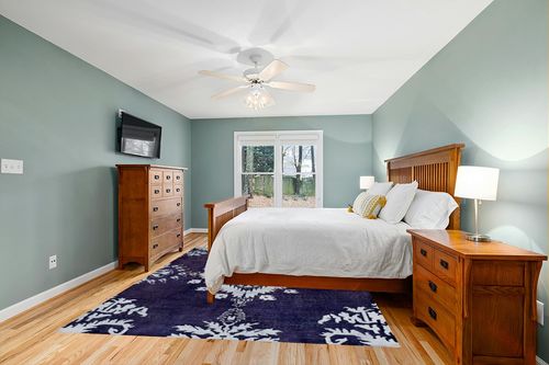 SAFAVIEH Stone Wash Collection 8' x 10' Deep Purple STW235K Hand-Knotted Medallion Premium Wool & Viscose Area Rug in Teal and Orange Wood Bedroom