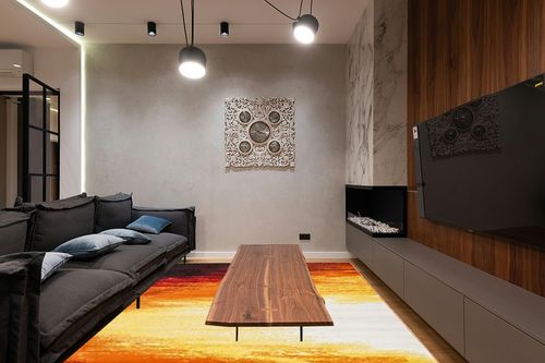 SAFAVIEH Metro Collection Contemporary Abstract Bright Warm Candle Light Area Rug, 9 ft x 12 ft, Orange/Yellow in Dark Wood Living Room with Black Couch