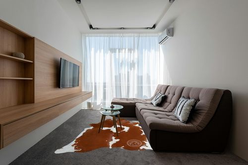 Genuine Brown and White Cowhide Rug XL 6 x 7-8 ft. 180 x 240 cm in Grey Living Room with Brown Couch