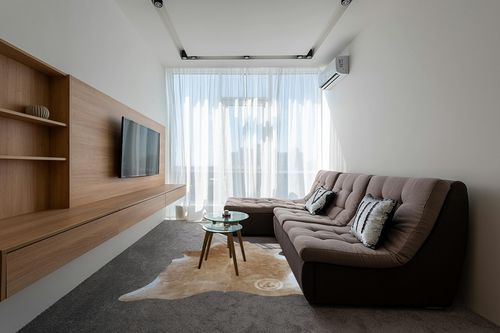 Genuine Palomino White and Beige Cowhide Rug 6 x 7-8 ft. 180 x 240 cm in Grey Living Room with Brown Couch
