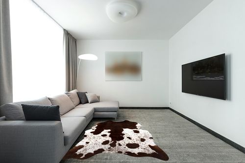 Quenlife Cowhide Rug for Living Room, Soft Cow Print Rug Cute Cow Rug for Bedroom, Cow Hide Rug Faux Animal Rug for Western Home Theme Room Decor, White and Browm, 5.2 x 6.2 ft in Modern Living Room with Grey Couch