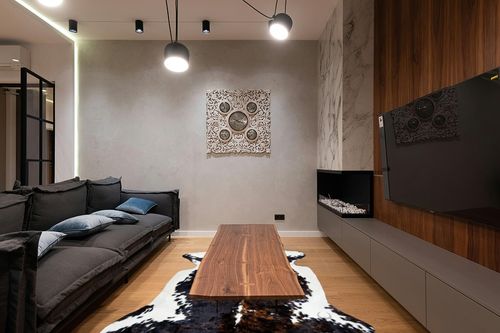 rodeo Cowhide Rug Dark Brindle Size 6x8 Feet Dc in Dark Wood Living Room with Black Couch