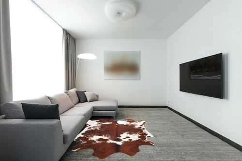 LYENDOS Cowhide Rug 5.2 x 6.2Feet,Cow Hide Rug Durable No-Slip Backing,Faux Cowhide Rug Thickened Elastic,for Bedroom Living Room Home Office Western Decor in Modern Living Room with Grey Couch