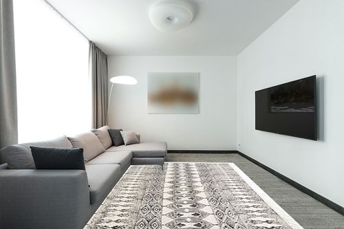 Black White Cotton Block Print Area Dhurrie Rug in Modern Living Room with Grey Couch