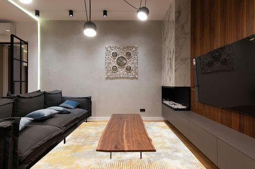 Art&Tuft Washable Rug in Dark Wood Living Room with Black Couch
