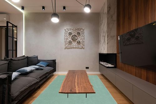 SAFAVIEH Fifth Avenue Collection Area Rug - 6' x 9', Green, Handmade Modern Solid Wool, Ideal for High Traffic Areas in Living Room, Bedroom (FTV128Y) in Dark Wood Living Room with Black Couch