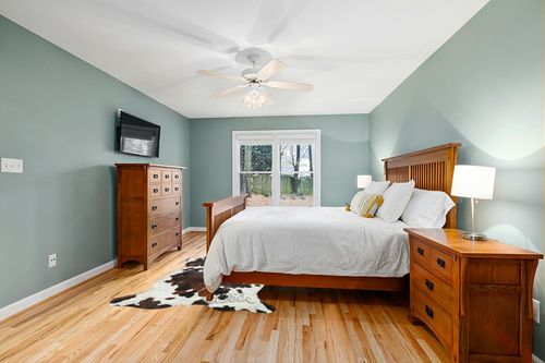 Tricolor Cowhide Rug Classic Brown, Black and White Color Mix, Natural Leather Hide, Area Rug (5x7 ft) in Teal and Orange Wood Bedroom