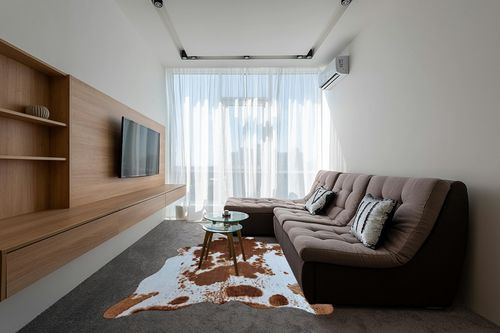 rugoo Premium Brown Cowhide Rug 6.4 ft x 8.5 ft Faux Cowhide Rug Cow Print Rug Faux Animal Skin Rug for Living Room Bedroom Nursery Western Decor in Grey Living Room with Brown Couch