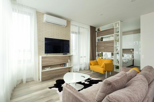 Cowhides Direct Genuine Cowhide Rug - Black & White Rug for Living Room, Bedroom & More - Authentic Cow Rug (6’x7’ Black & White) in Light Modern Living Room with TV