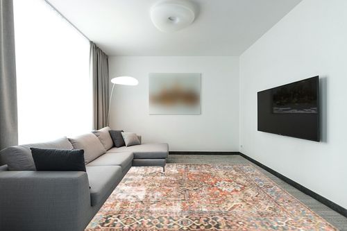 Loloi II Loren Terracotta/Sky 8'-4" x 11'-6" Area Rug in Modern Living Room with Grey Couch