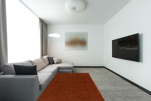 SAFAVIEH Montauk Collection Area Rug - 5' x 8', Orange & Black, Handmade Flat Weave Cotton Corner Tassel, Ideal for High Traffic Areas in Living Room, Bedroom (MTK150P) in Modern Living Room with Grey Couch