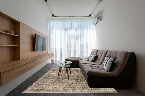 Loloi Magnolia Home by Joanna Gaines x Millie Charcoal/Dove 7'-10" x 10' Area Rug in Grey Living Room with Brown Couch