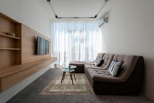 Loloi Amber Lewis x Loloi Georgie Collection GER-07 Moss/Salmon 5'-0" x 7'-6" Area Rug in Grey Living Room with Brown Couch