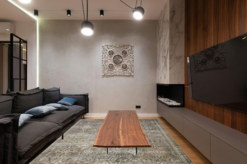 ‎Pebble / Taupe ‎Traditional ‎Washable ‎Living Room ‎Area Rug in Dark Wood Living Room with Black Couch