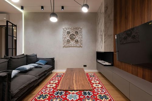 SAFAVIEH Heritage Collection Area Rug - 6' x 9', Red & Blue, Handmade Traditional Oriental Wool, Ideal for High Traffic Areas in Living Room, Bedroom (HG746Q) in Dark Wood Living Room with Black Couch