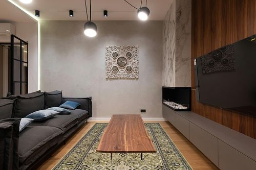 SUPERIOR Indoor Area Rug, Jute Backed, Perfect for Entryway, Office, Living/Dining Room, Bedroom, Kitchen, Hardwood Floor, Floral Medallion Decor, Radcliffe Collection, 6' x 9', Green in Dark Wood Living Room with Black Couch