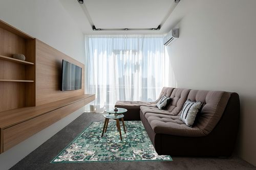 LUXE WEAVERS Moroccan Green 6x9 Medallion Area Rug for Living Rooms in Grey Living Room with Brown Couch