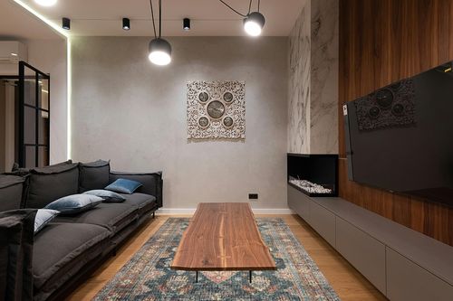 Loloi II Skye Collection SKY-10 SEA / RUST, Traditional 6'-0" x 9'-0" Area Rug in Dark Wood Living Room with Black Couch