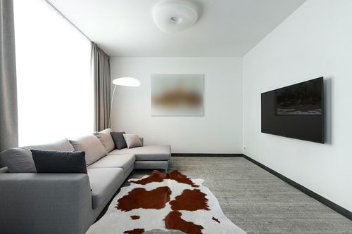 A-STAR Brown & White Cowhide Leather Rug Natural Premium Cow Skin Hide Hair on Area Rug for Living Room Décor 5ft x 7ft (152 CM X 213 CM) XX-Large in Modern Living Room with Grey Couch