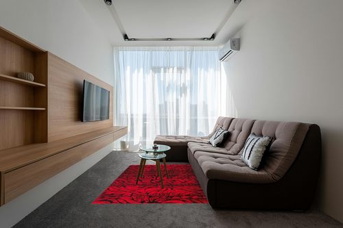 Antep Rugs Floral 5x7 Abstract Indoor Area Rug Siesta (Red Black, 5'3" x 7') in Grey Living Room with Brown Couch