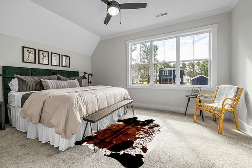 CONBEN Oversized Faux Cowhide Rug (6.3ft x 8.3ft) - Non-Slip Backing, Cow Print Decor - Farmhouse, Western Floor Rugs for Living Room, Bedroom, Dining Area or Office in Grey Traditional Bedroom with King Bed