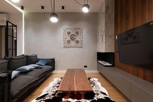 CONBEN Oversized Faux Cowhide Rug (6.3ft x 8.3ft) - Non-Slip Backing, Cow Print Decor - Farmhouse, Western Floor Rugs for Living Room, Bedroom, Dining Area or Office in Dark Wood Living Room with Black Couch