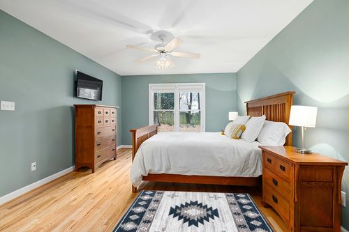 Well Woven Southwestern Rodrigo 3'11" x 5'3" Blue Area Rug in Teal and Orange Wood Bedroom