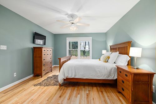 MustMat Faux Animal Rug Black and White Leopard Print Rugs for Living Room Approx 4.5'x6.2' in Teal and Orange Wood Bedroom