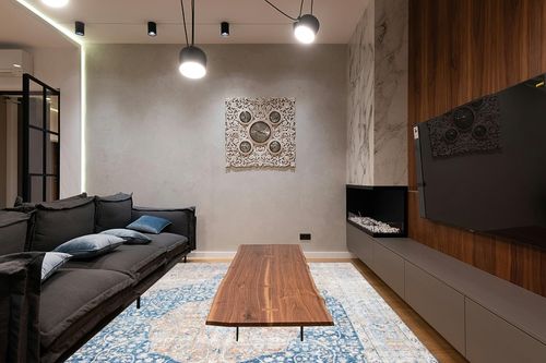 Loloi II Layla Collection LAY-07 Blue/Tangerine, Traditional 9'-0" x 12'-0" Area Rug in Dark Wood Living Room with Black Couch