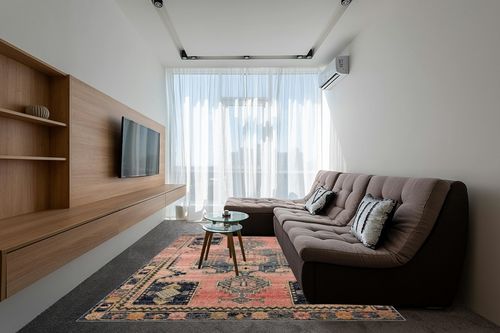 Loloi II Jocelyn Collection JOC-06 Rose/Rose 7'-10" x 10' Area Rug in Grey Living Room with Brown Couch