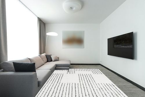 JONATHAN Y MOH407A-8 Petra Abstract Stripe Geometric Shag Indoor Area-Rug Bohemian Contemporary Glam Easy-Cleaning Bedroom Kitchen Living Room Non Shedding, 8 X 10, White/Black in Modern Living Room with Grey Couch