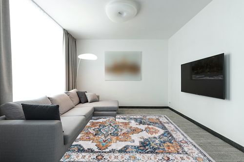 8x10 Area Rugs for Living Room Bedroom: Large Washable Rug with Non-Slip Backing Non-Shedding Stain Resistant, Boho Floral Large Carpet for Dining Room Nursery Home Office Indoor Blue/Orange in Modern Living Room with Grey Couch