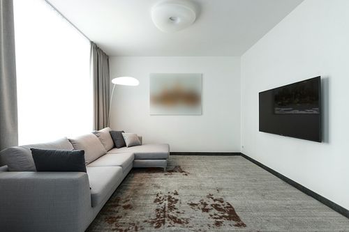 nuLOOM Marcia Machine Washable Faux Cowhide Area Rug, 5' 9" x 7' 7", Brown in Modern Living Room with Grey Couch