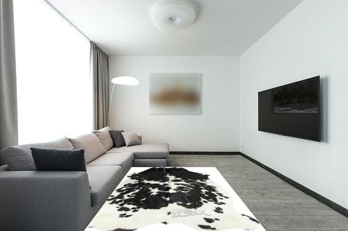 HIDES BAZAAR Classic Black and White Cowhide Rug, Premium Quality Genuine Leather Cow Hide, Area Rug (6x7 ft) in Modern Living Room with Grey Couch