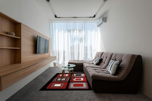 United Weavers Dallas Spaces Accent Rug in Grey Living Room with Brown Couch