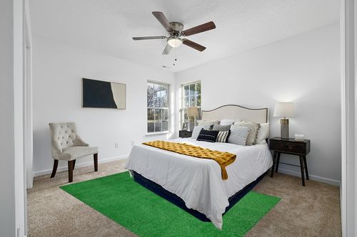 Garland Rug Artificial Grass 6 ft. x 9 ft. Large Indoor/Outdoor Area Rug Green in White and Yellow Modern Bedroom