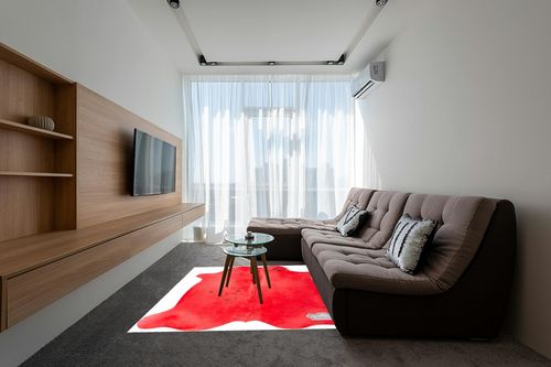 Appaloosa Cowhides Color Dyed Collection (Rusty Red) in Grey Living Room with Brown Couch