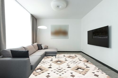 SAFAVIEH Moroccan Tassel Shag Collection Area Rug - 9' x 12', Ivory & Brown, Boho Design, Non-Shedding & Easy Care, 2-inch Thick Ideal for High Traffic Areas in Living Room, Bedroom (MTS688A) in Modern Living Room with Grey Couch