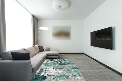 LUXE WEAVERS Abstract Distressed Green 5x7 Area Rug for Living Room in Modern Living Room with Grey Couch