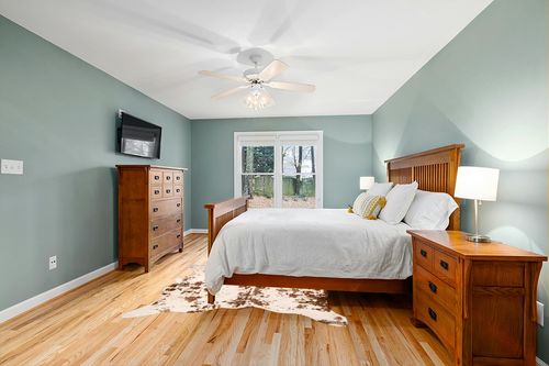 nuLOOM Iraida Contemporary Faux Cowhide Area Rug, 5' 9" x 7' 7", Brown in Teal and Orange Wood Bedroom