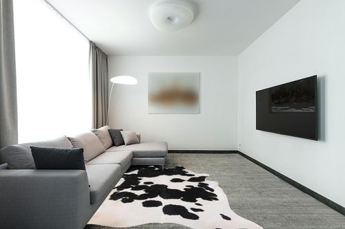 Home Must Haves Cowhide Rug, 6' x 7', Black and White in Modern Living Room with Grey Couch