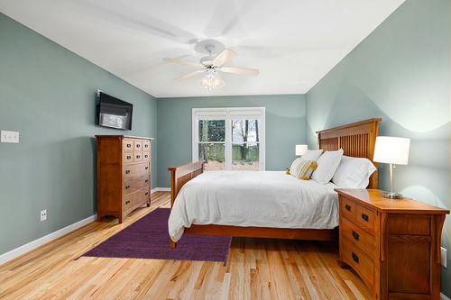 SAFAVIEH Montauk Collection Area Rug - 5' x 8', Purple & Black, Handmade Corner Tassel Flat Weave Cotton, Ideal for High Traffic Areas in Living Room, Bedroom (MTK150R) in Teal and Orange Wood Bedroom