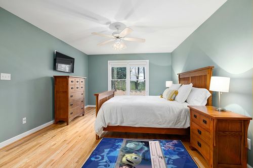 Jay Franco Disney Monsters Inc Scare Team Room Rug - Large Area Rug Measures 4 x 5 Feet Features Mike Wazowski, James Sullivan, & Boo (Offical Disney Product) in Teal and Orange Wood Bedroom