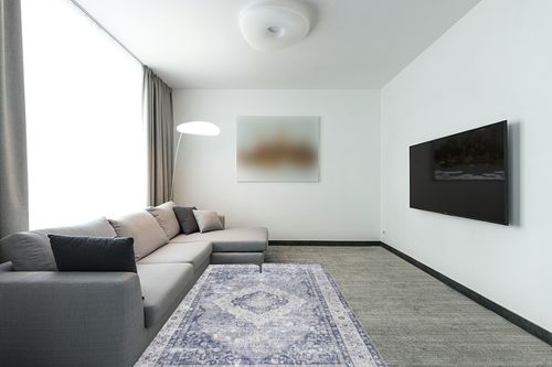 nuLOOM Elsa Floral Blossom Machine Washable Area Rug, 5x8, Blue in Modern Living Room with Grey Couch
