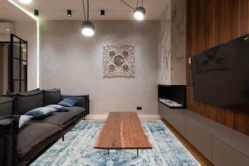 Artistic Weavers Desta Vintage Oriental Area Rug, 7'10" x 10'2", Blue/White in Dark Wood Living Room with Black Couch